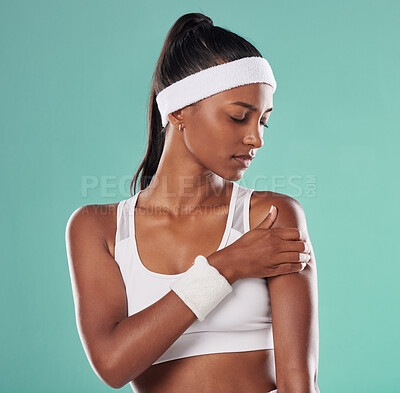 Buy stock photo Sports injury, arm pain and tennis player suffering with sore muscles after a ball game at the court. Painful, hurt and discomfort woman after sport training or match against a studio background.