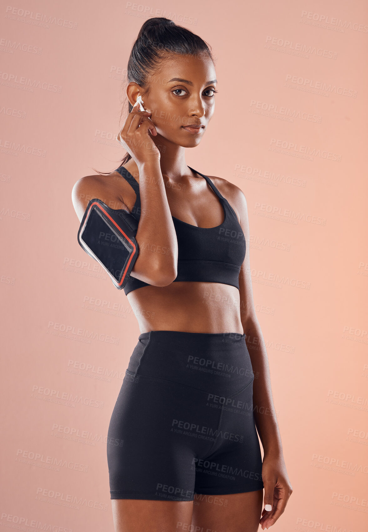 Buy stock photo A listening to music, fit and healthy slim woman living a active, wellness and body or weight watching lifestyle. Fitness, training and sports lover ready for workout routine with athletic sportswear