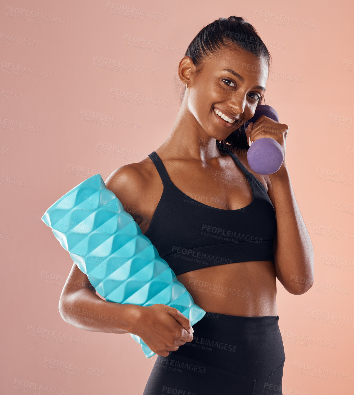 Buy stock photo Smiling, healthy and slim female fitness instructor, holding weights and exercise equipment or tools for workout. Beautiful woman athlete with a fit body in gym sportswear against studio background