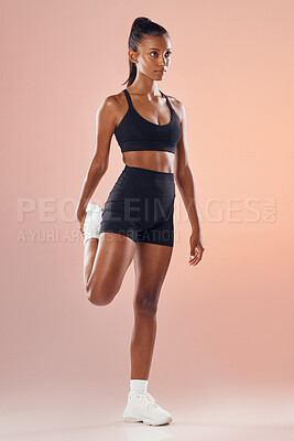 Buy stock photo Fitness, exercise and workout athlete stretching out her legs before training indoors to stay healthy and young. Active, body and sporty woman warms up strong muscles for her motivated lifestyle