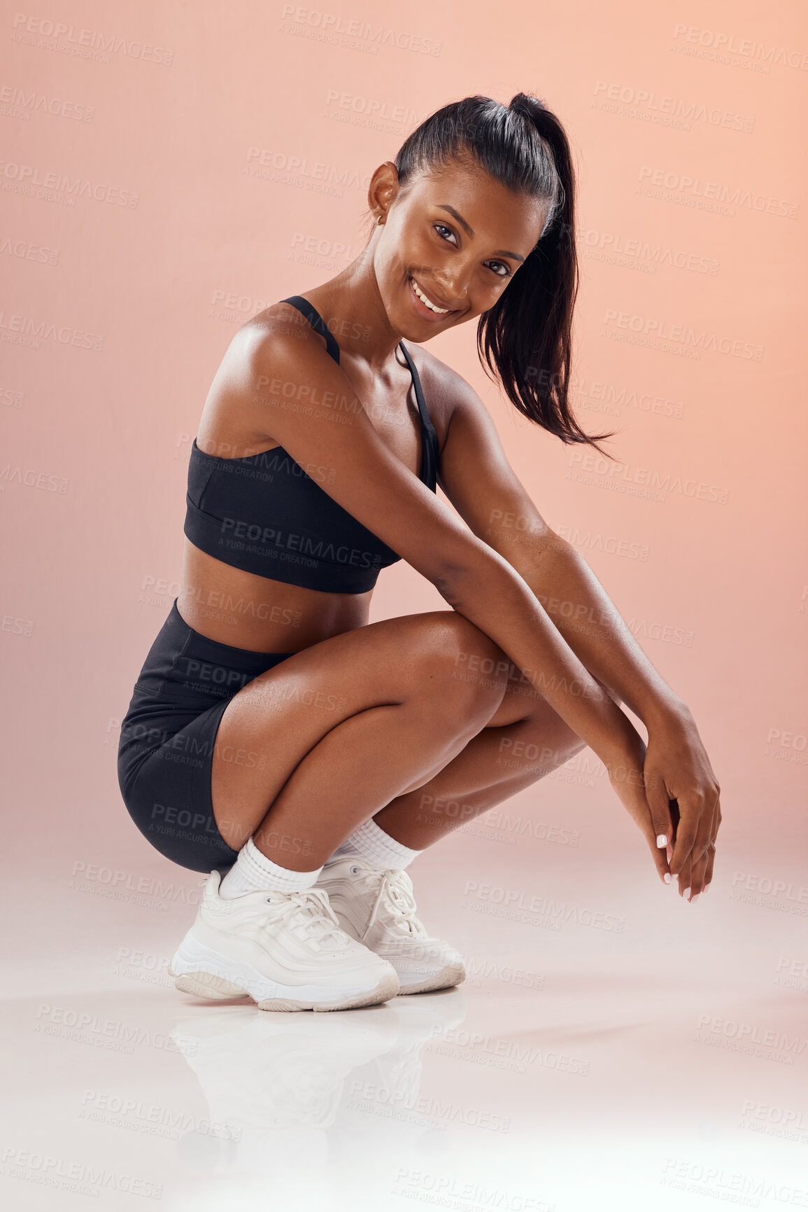 Buy stock photo Stylish, fit and trendy female athlete model in sportswear against pink studio background. Portrait of an athletic and cute African American young woman relaxing with a sports style or fashion