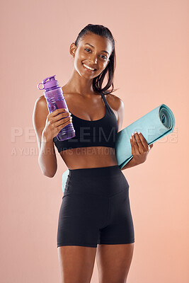 Buy stock photo Fit body, healthy and athletic woman in studio holding mat and water bottle for yoga, pilates or exercise on pink background. Portrait of sporty, active or slim athlete ready for workout or training 