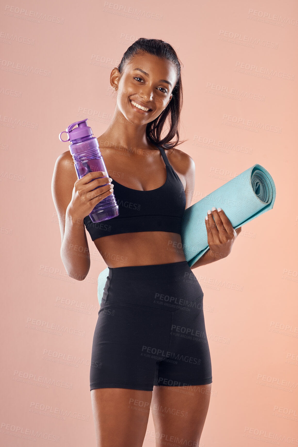 Buy stock photo Fit body, healthy and athletic woman in studio holding mat and water bottle for yoga, pilates or exercise on pink background. Portrait of sporty, active or slim athlete ready for workout or training 