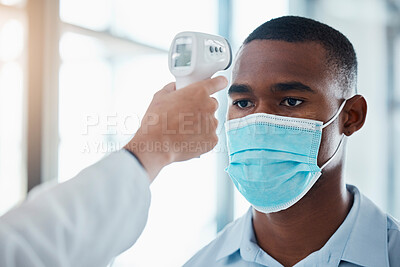 Buy stock photo Man with covid taking temperature with thermometer at hospital, checking for fever and wearing face mask to prevent risk of virus. Face of male examining health with doctor and doing checkup