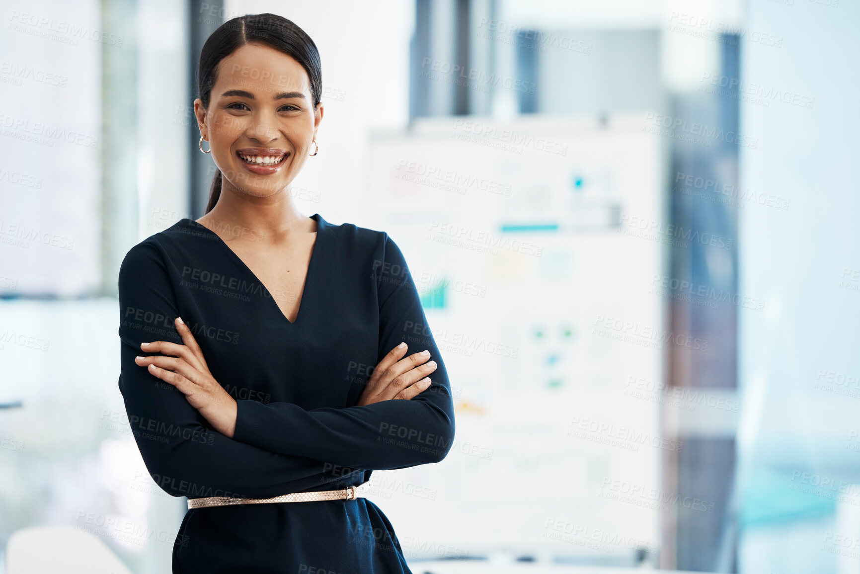 Buy stock photo Confident, happy and smiling business woman standing with her arms crossed while in an office with a positive mindset and good leadership. Portrait of an entrepreneur feeling motivated and proud