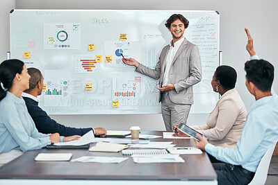 Buy stock photo Business coach presenting marketing or financial budget report and accounting statistics or sales charts on white board. Leader and mentor discussing company growth strategy with diverse colleagues.