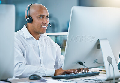 Buy stock photo Professional, friendly customer service or sales consultant agency worker working with headset and desktop. Smiling male employee consulting with a client at call center or contact us helpdesk 