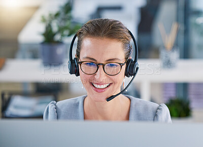 Buy stock photo Call center agent helping clients online while talking on a headset in a modern office, enjoying her career. Customer service and support with a happy, friendly woman excited to guide and answer 