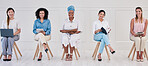 Female corporate marketing or advertising planning team working in a creative agency for online website design company. Portrait of empowering women in diverse workplace with good ideas and strategy