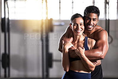 Buy stock photo Strong, active and wellness couple looking fit and healthy after workout training session in a gym. Young sexy, attractive and athletic boyfriend and girlfriend hugging after reaching fitness goal