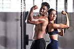 Fitness, flexing muscles and strong couple goals while doing exercise or training in a gym. Portrait of fit sports people, woman or man showing off their biceps after exercising for arm strength