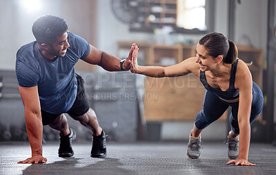 Buy stock photo Fitness, motivation and high five while doing push ups and exercising together at the gym. Healthy, fit and athletic couple goals while enjoying a training session with teamwork at a health club