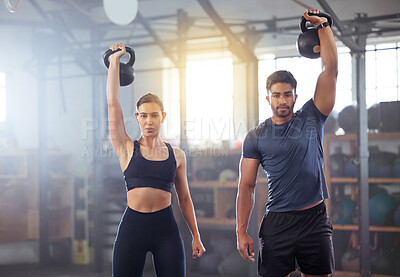 Buy stock photo Fitness couple doing a kettlebell workout, exercise or training in a gym. Fit sports people, woman or man with a strong grip, exercising using gyming equipment to build muscles and forearm strength