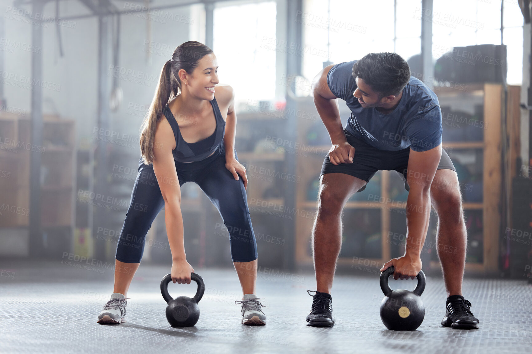Buy stock photo Strong, wellness couple doing kettlebell weight exercise, workout or training inside a gym. Happy sports people or trainer motivation, exercising with fitness equipment for muscle, strength or health