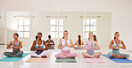 Meditation, yoga and zen friends class in relaxing, healthy and calm pilates studio for holistic breathing, mental health and mindfulness. Diverse group of meditating yogi women in namaste hand mudra