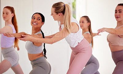 Buy stock photo Yoga instructor, group training and pilates class for women in fitness, exercise and training studio. Yogi helping correct body form, posture and warrior pose for healthy lifestyle and flexible body