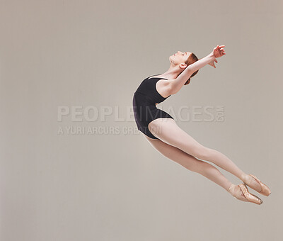 Buy stock photo Ballet dancer dancing, training and artistically jumping in the air with flexibility, fitness and performance. Healthy, motion and talented ballerina exercises for a classical act in studio

