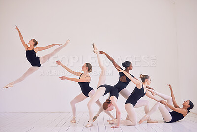 Buy stock photo Group of contemporary or ballet dancers performing a unique sequence in a studio. Team of modern elegant ballerinas dancing or practicing for performance and creating entertainment art