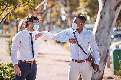 Buy stock photo Businessmen elbow greeting in covid 19 masks outside in a parking lot showing teamwork and diversity in summer. Sun, world and social safety protocol by people who work for a global corporate company