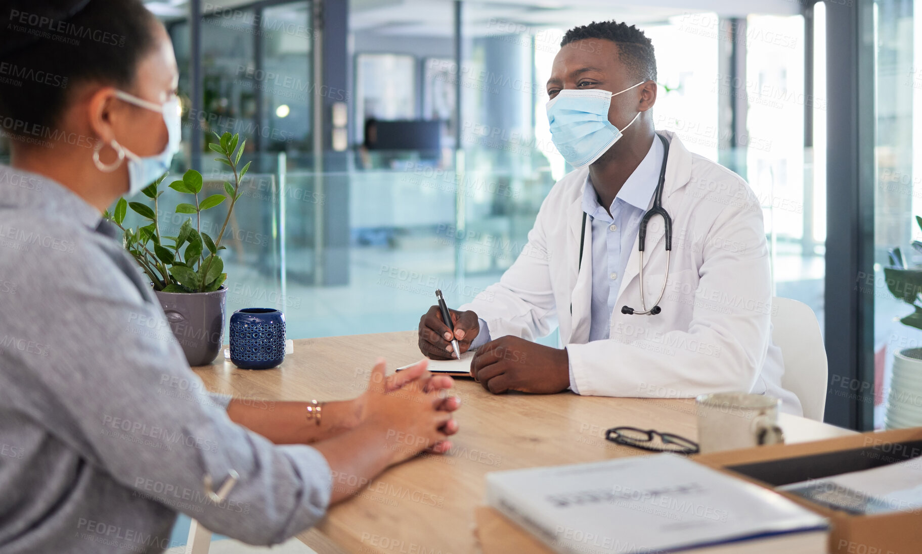 Buy stock photo Covid doctor talking to patient for a medical checkup, wellness consult and healthcare screening in a clinic. Trusted gp, physician and essential worker discussing medicine and consulting health