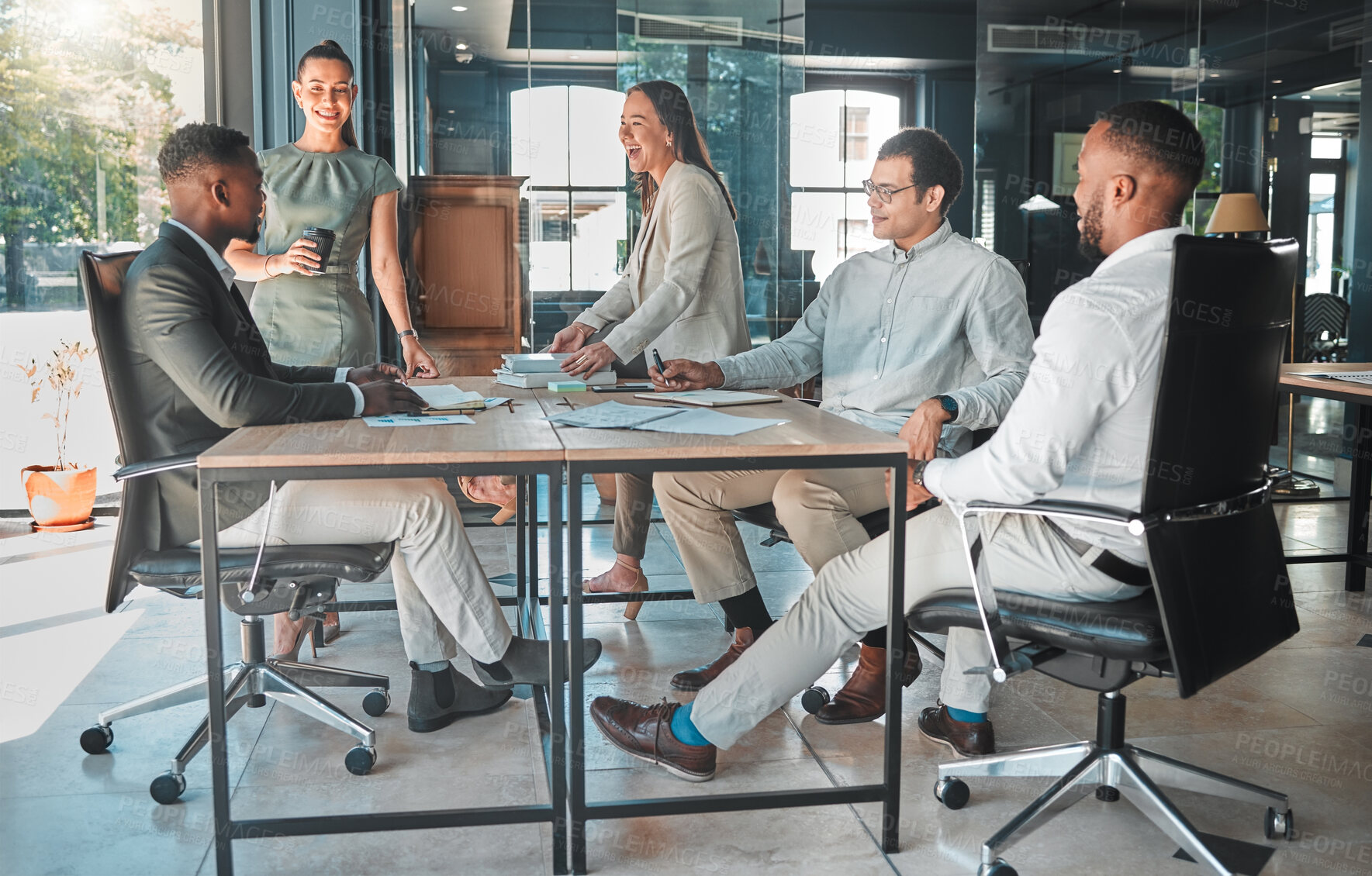 Buy stock photo Business meeting in a boardroom of colleagues talking and planning company growth strategy together. Group or team of diverse and happy employees having a discussion in a modern office