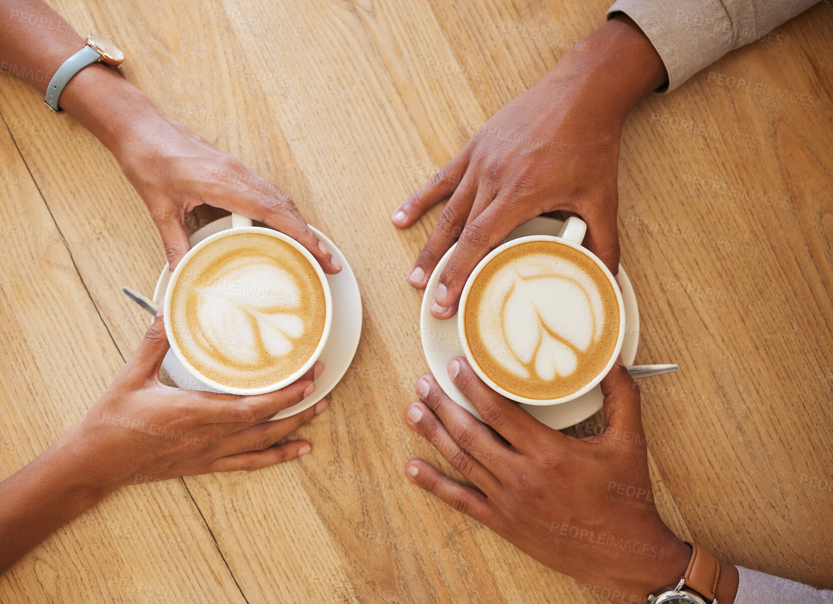 Buy stock photo Creative latte art, cappuccino and coffee drink in cafe with couple and friends enjoying cup of java with milk froth together. Closeup of people hands from above meeting and drinking in restaurant