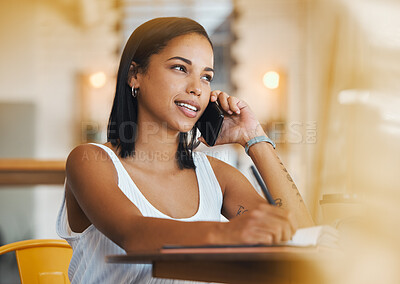 Buy stock photo Freelance worker working in a coffee shop talking on a phone call about a growth strategy. Young female student with a positive mindset doing remote work in a cafe and having a mobile conversation