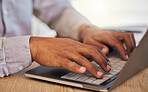Closeup of a businessman's hands typing on laptop at work in corporate, creative and modern office. Professional male leader browsing the internet or coding on an innovative computer network.