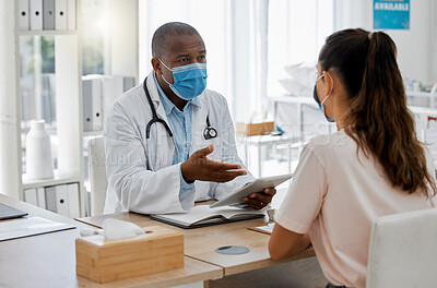 Buy stock photo Doctors office, masks and sick patient consulting healthcare medic for covid virus test results at a hospital desk. Life insurance, people and medical employee giving woman support, help and service