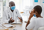 Doctor appointment by a woman with a headache or covid symptoms consulting a healthcare professional at the hospital. Black male medical worker or GP has a consultation with an ill or sick patient