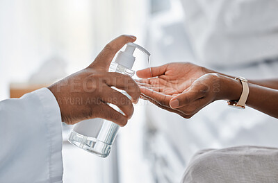 Buy stock photo Doctor giving patient hand sanitizer for protection, hygiene and bacteria disinfection in covid pandemic, protocol and virus. Healthcare safety and cleaning hands to prevent flu, corona and illness
