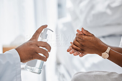 Buy stock photo Doctor giving patient hand sanitizer for covid protection, hygiene and protocol in hospital or clinic. Healthcare safety, flu germs and cleaning hands to prevent sick, bacteria virus and health risk