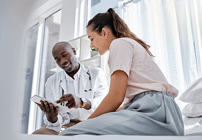 Buy stock photo Doctor appointment or healthcare professional consulting a patient and showing her online medical results on a tablet. Medical worker or GP talking to a woman in a hospital or clinic