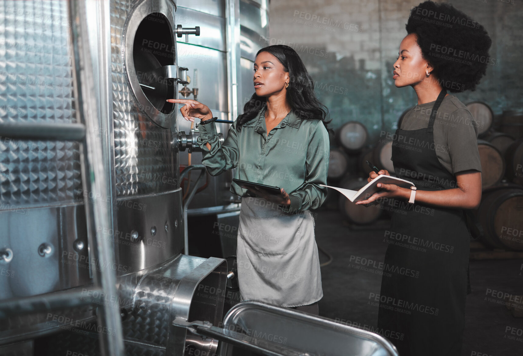 Buy stock photo Agriculture workers at wine farm factory distillery, research steel barrels and talk alcohol drink production process. Farmers in warehouse distillery manufacturing chardonnay or winery industry