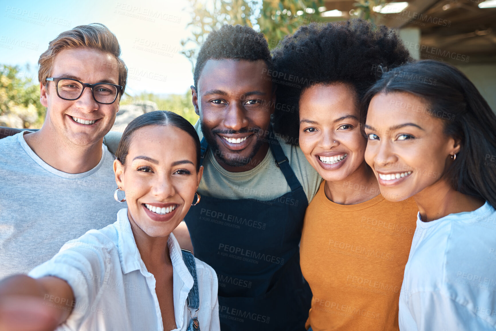 Buy stock photo Portrait of diverse friends taking a selfie, bonding and enjoying their freedom outdoors together. Young group having fun, smiling and looking happy on a weekend, hanging out and loving friendship 