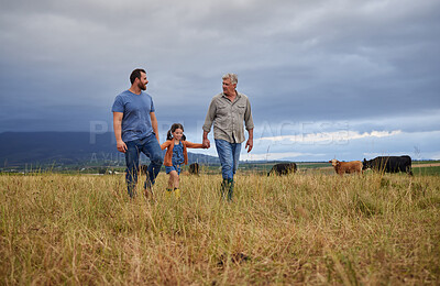 Buy stock photo Farmer family walking on a cattle or livestock farm teaching and learning together. Generations of a happy father, grandfather and grandchild bonding on sustainability agriculture land