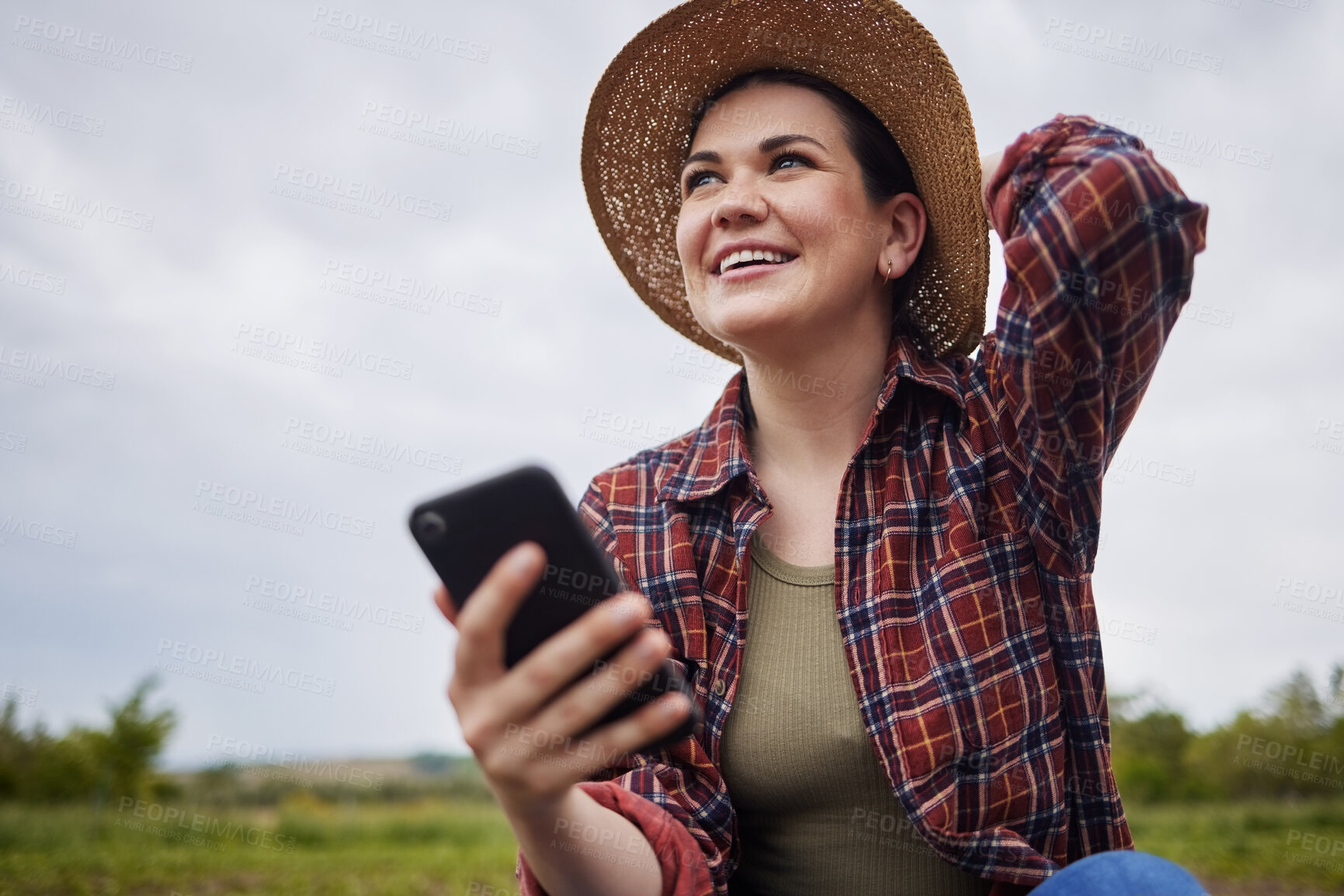Buy stock photo Agriculture, nature and 5g connection by farmer texting on a phone, reading social media while relaxing outdoors. Happy worker browsing the internet for natural sustainability tips, products online
