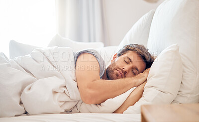 Buy stock photo Home, bedroom and sleeping man in the morning lying his head on the pillow in apartment space. Tired, fatigue and relax male taking time off on the weekend in bed of airbnb or hotel accommodation 