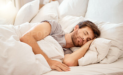 Buy stock photo Relax, sleep and peace of a tired man sleeping in a bedroom bed at home. Dreaming, relaxing and resting calm attractive person with closed eyes on a pillow at his house in the morning taking a nap  
