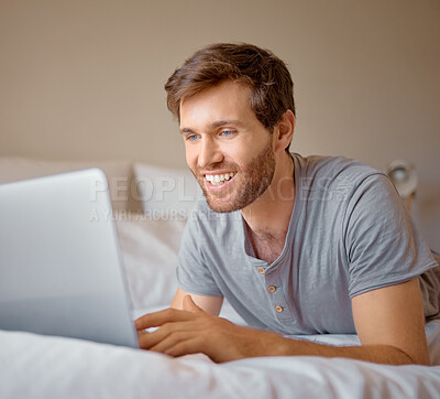 Buy stock photo Happy, smile or man streaming on laptop in home bedroom on movie subscription app or playing esports game. Relax person on house bed searching social media or reading news on communication technology