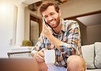 Communication, coffee and man with phone on sofa in living room. Success, internet and working from home with tea. Happy businessman, startup owner with a laptop on a mobile phone call with a client.