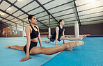 Ballet, art and creative dancers stretching in a gymnastics studio while training for concert. Elegant, fit and artistic man and woman athletes practicing dance to classical music for a theater show.