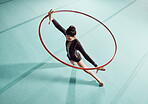 gymnastics woman with hoop to work on training, fitness and exercise or workout. Gymnast girl at sport competition event in gym or gymnastic center working with motivation, goal and winner mindset

