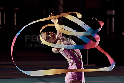 Buy stock photo Woman dancing with ribbon in concert in arena, dancer doing creative, artistic and cardio dance and training a performance in dark studio. Girl gymnast doing sport workout and strong in competition