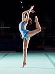 Sports competition woman dancer dancing in a dark ballet arena or training performance for a concert, theatre production or professional event. Young person, athlete or artist in gymnastics dance