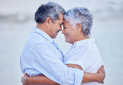 Buy stock photo Travel couple giving hug on beach in nature, man and woman with smile on ocean holiday vacation in retirement and happy senior people with smile by sea in summer. Husband and wife in happiness