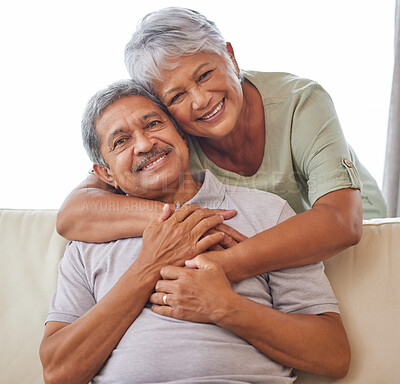 Buy stock photo Senior couple portrait, love, and hug in relax home living room bonding in safety, security and trust. Elderly people, retirement and care for happy man and woman with smile on sofa in house interior