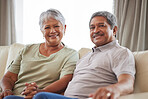 Love, smile and senior couple on living room interior sofa relax and lounge together at home portrait. Face of happy  people, man and woman smile while living retirement lifestyle at family house