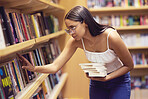 Library, books and woman reading print book for her college or university education and learning. Knowledge of young gen z scholarship student at shelf, studying for an English project exam or test 