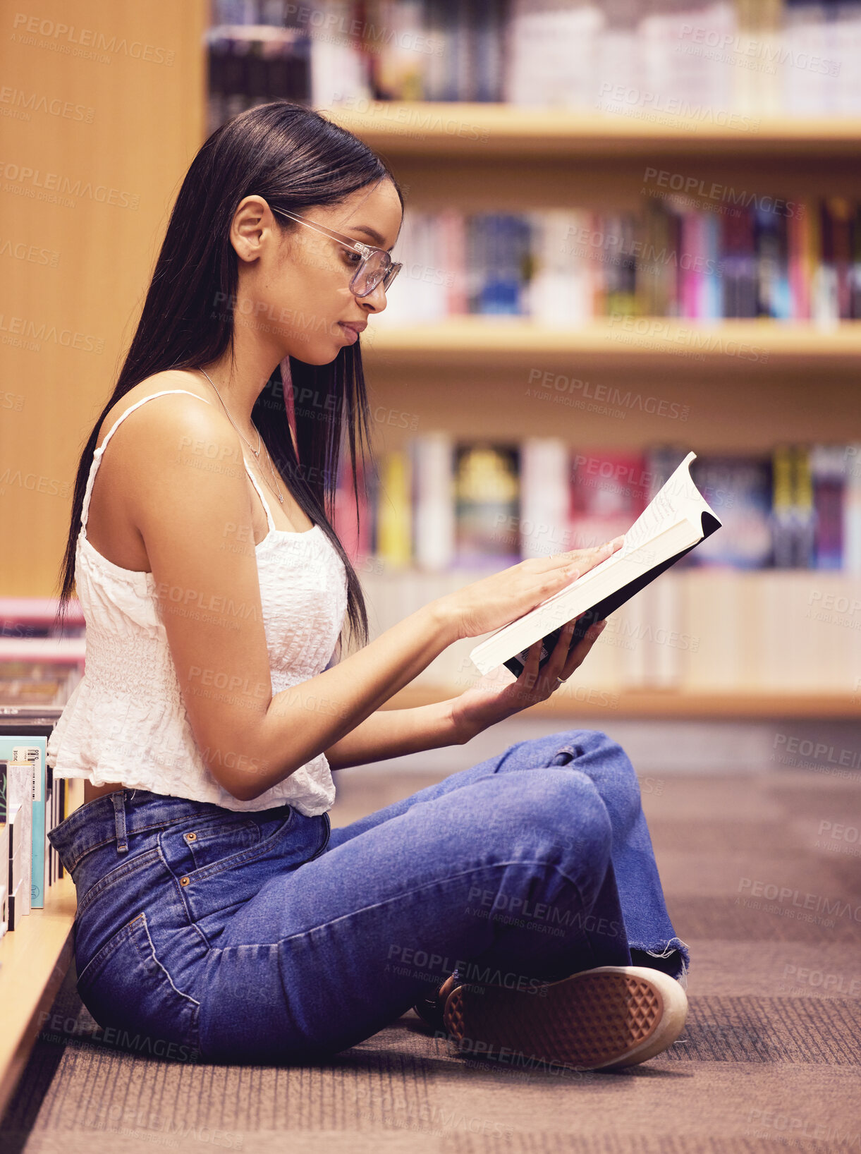 Buy stock photo College university student reading library books on ground floor for education, study and campus learning. Young nerd woman at bookstore studying for story project, knowledge test and exam assignment